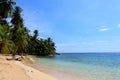 Young beautiful woman enjoying her time and resting close to the sea in the southern beach of Pelicano Island, Panama. Royalty Free Stock Photo