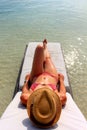 Young beautiful woman enjoying her time and resting close to the sea Royalty Free Stock Photo