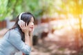 Young beautiful woman enjoying music in the garden listening to music with headphones Royalty Free Stock Photo