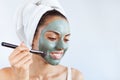 Young beautiful woman in face mask of therapeutic blue mud. Spa Royalty Free Stock Photo