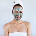 Young beautiful woman in face mask of therapeutic blue mud. Spa Royalty Free Stock Photo