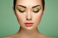 Young beautiful woman with flower makeup eyes Royalty Free Stock Photo