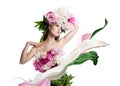 Young beautiful woman with flowers peonies. Beautiful flowers and easy cloth flying.