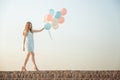 beautiful woman with flying multicolored balloons Royalty Free Stock Photo