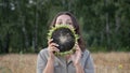 Young beautiful woman funny posing with sunflower on a hot summer day Royalty Free Stock Photo