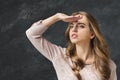 Young beautiful woman gazes into distance, Royalty Free Stock Photo