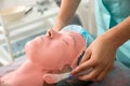 Young beautiful woman get alginate modeling mask to the face in a beauty salon