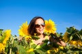 Young beautiful woman girl on background of sunflower field Royalty Free Stock Photo