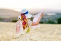 Young beautiful woman on golden cereal field Royalty Free Stock Photo