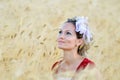 Young beautiful woman on golden cereal field in summer Royalty Free Stock Photo