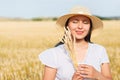 Young beautiful woman in golden wheat field. concept of summer, freedom, warmth, harvest, agriculture Royalty Free Stock Photo