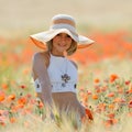 Young beautiful woman on golden wheat field in summer Royalty Free Stock Photo