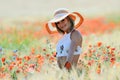 Young beautiful woman on golden wheat field in summer Royalty Free Stock Photo