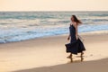 Young beautiful woman has fun at the ocean in summertime Royalty Free Stock Photo