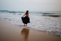 Young beautiful woman has fun at the ocean in summertime Royalty Free Stock Photo