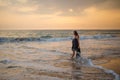 Young beautiful woman has fun at the ocean in summertime Royalty Free Stock Photo