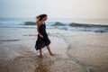 Young beautiful woman has fun at the ocean in summertime Royalty Free Stock Photo