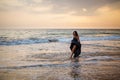 Young beautiful woman has fun at the ocean in summertime Royalty Free Stock Photo