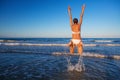 Young beautiful woman has fun at the sea in summertime Royalty Free Stock Photo