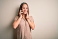 Young beautiful woman having conversation talking on the smartphone over white background touching mouth with hand with painful Royalty Free Stock Photo