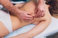 Young beautiful woman having massage in spa salon Physiotherapis. Royalty Free Stock Photo
