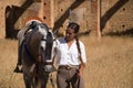 Young and beautiful woman with her horse, resting with him, caressing him, happy in the countryside. Concept horse riding, animals Royalty Free Stock Photo