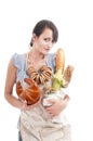 Young beautiful woman holding bags with fresh bread