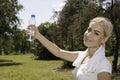 Young beautiful woman holding a bottle of water Royalty Free Stock Photo