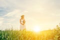 Young beautiful woman holding bouquet pink flowers enjoying in t Royalty Free Stock Photo