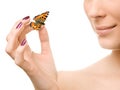 Young beautiful woman holding a butterfly Royalty Free Stock Photo