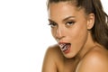 Young beautiful woman holding ice cube in her mouth Royalty Free Stock Photo