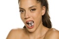 Young beautiful woman holding ice cube in her mouth Royalty Free Stock Photo