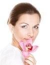 Young beautiful woman holding pink flower Royalty Free Stock Photo
