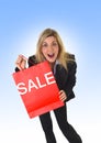 Young beautiful woman holding sale red shopping bag Royalty Free Stock Photo