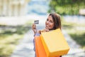 Beautiful woman holding shopping bags and a credit card Royalty Free Stock Photo