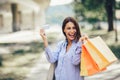 Beautiful woman holding shopping bags and a credit card Royalty Free Stock Photo