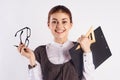 Young beautiful woman holds glasses and documents on white background, portrait, teacher, smile