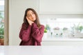 Young beautiful woman at home sleeping tired dreaming and posing with hands together while smiling with closed eyes Royalty Free Stock Photo