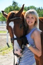 Young beautiful woman with horse Royalty Free Stock Photo