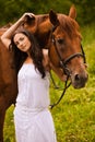 Young beautiful woman with horse Royalty Free Stock Photo