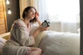 Young beautiful woman in a house dressing gown