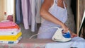 Young beautiful woman ironing clothes. Housework Royalty Free Stock Photo