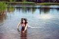 Young beautiful woman in the lake water Royalty Free Stock Photo