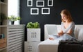 Young beautiful woman with laptop and cup of coffee in morni Royalty Free Stock Photo