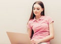 Young beautiful woman with laptop notebook on floor home surfing internet Royalty Free Stock Photo