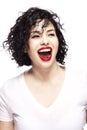 Young beautiful woman is laughing. Close-up. Isolated over white background. Vertical