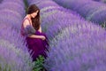 Young beautiful woman in lavender fields with a romantic mood Royalty Free Stock Photo