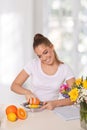 Young beautiful woman licking lemon with grimace on her face Royalty Free Stock Photo