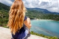 Young beautiful woman with long blonde flying hair, travel conc Royalty Free Stock Photo