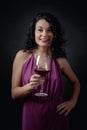 Portrait of attractive brunette in long evening dress with glass of red wine Royalty Free Stock Photo